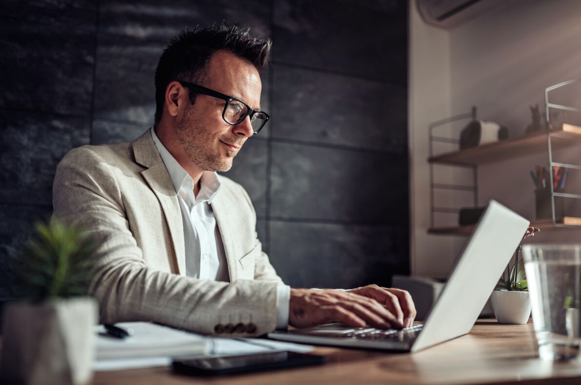 Man using laptop to receive SMS verification code